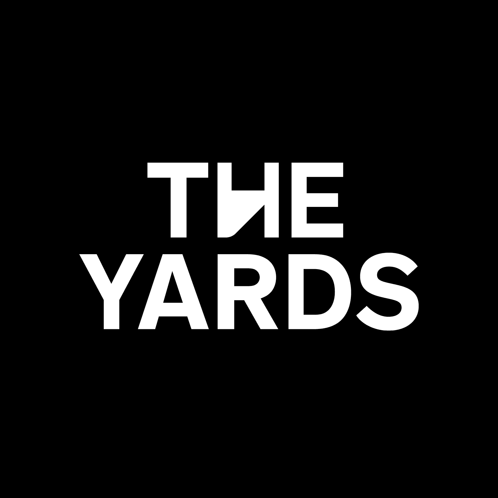 Weisses The Yards Logo auf schwarzem Hintergrund.
