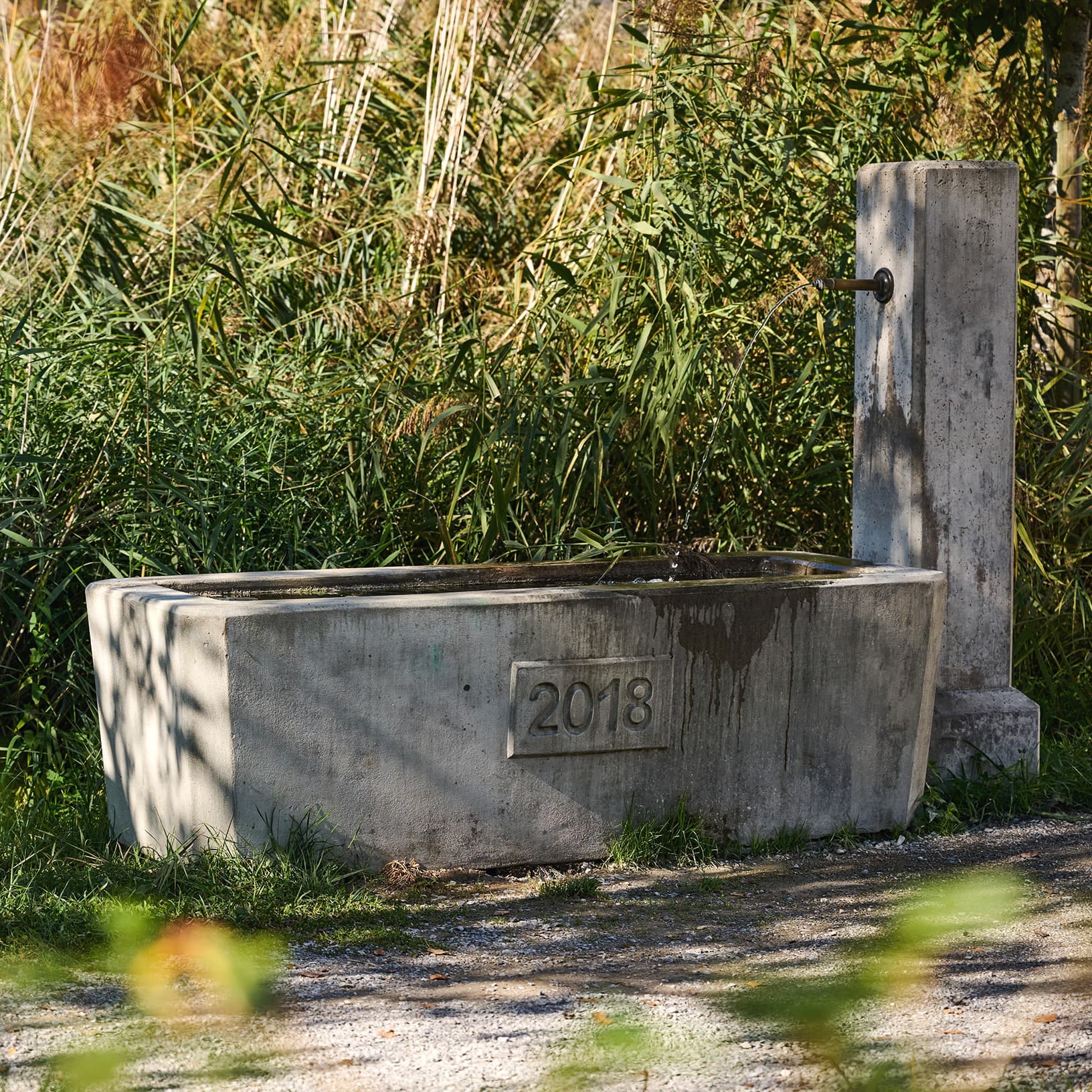 Betonbrunnen im The Yards Ried